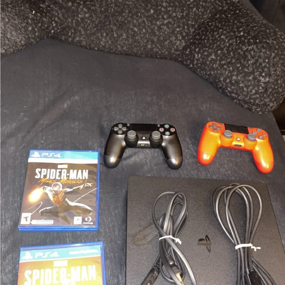 Sony PlayStation 4 with Black and Red Controllers